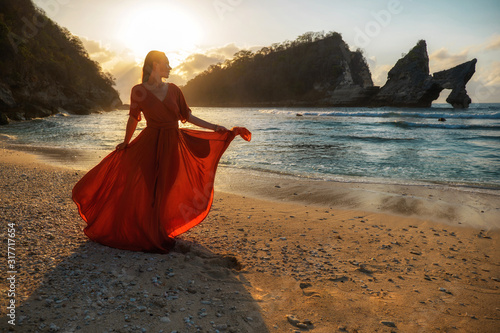 Woman at Atuh beach at Nusa Penida Island, Bali, Indonesia photo