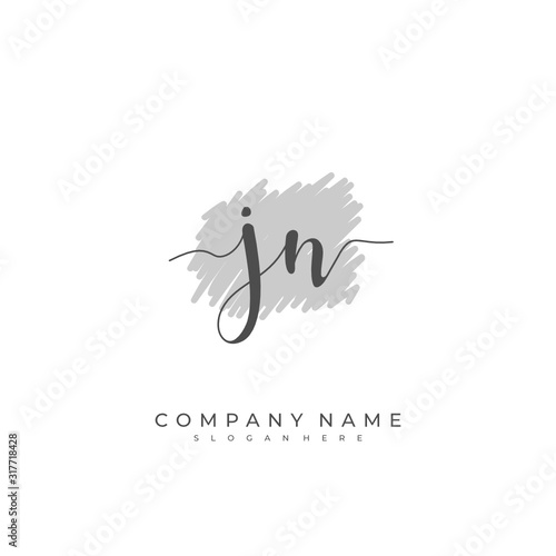 Handwritten initial letter J N JN for identity and logo. Vector logo template with handwriting and signature style. photo