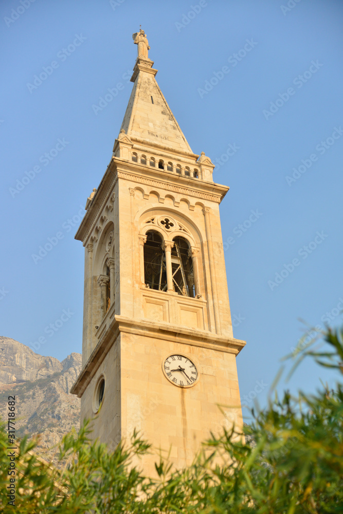 Church in background with olive leaves