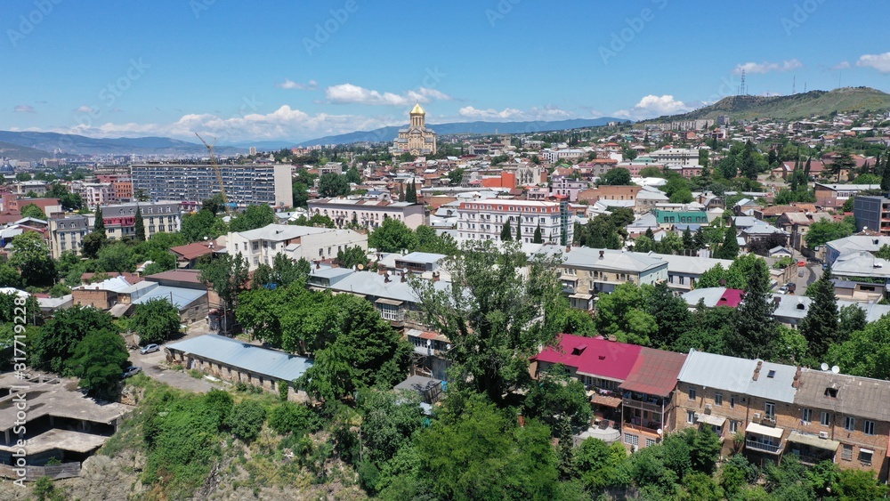 Aerial view of Tbilisi Old Town. old georgian houses, buildings. Holy Trinity Cathedral of Tbilisi. Church. Georgia.