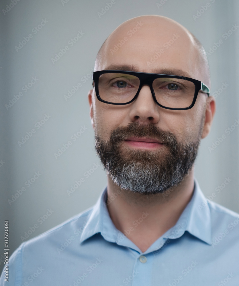 Bearded middle-aged man wearing glasses Bearded middle-aged man wearing glasses