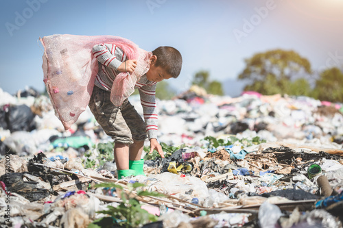 Obraz na plátne Poor children collect garbage for sale because of poverty, Junk recycle, Child l