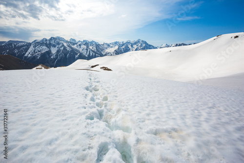 Footprints in the snow, Karachay-Cherkessia, Russia. Caucasus Mountains landscape. © Crazy nook
