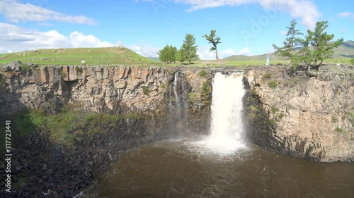 Orkhon Orhon is a waterfall located in the valley of Ovorkhangai aimag in central Mongolia. It originates in Khangai merges to Selenge River reaching Lake Baikal. Geological depression collapse. 4K. photo