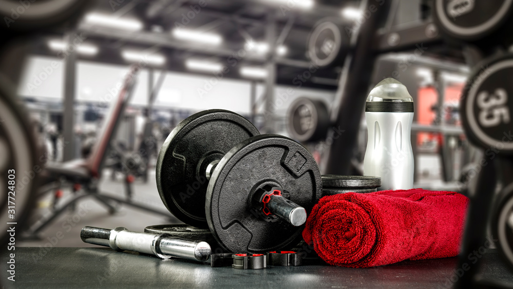 Black desk of free space for your decoration and blurred gym interior.Metal dumbbells and fit life Black desk of free space for your decoration and blurred gym interior.Metal dumbbells and fit life