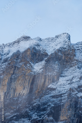 View from top of snow covered mountain. jungfrau mountain in swiss alps. photo