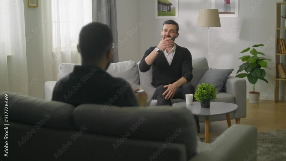 Young man in session with a psychotherapist Young man in session with a psychotherapist
