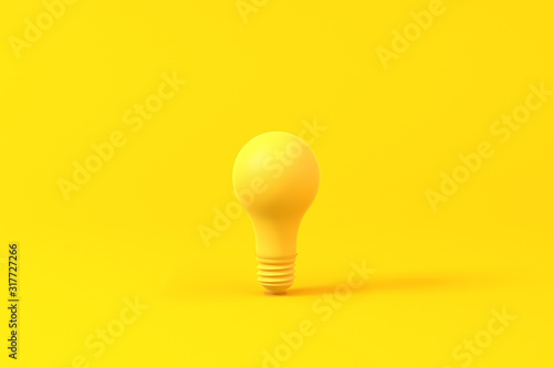 Light bulb isolated over a yellow background. Minimalist concept.