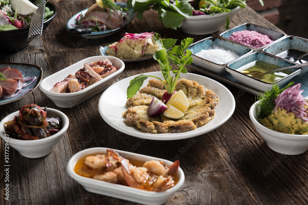 cooked fish and various appetizers