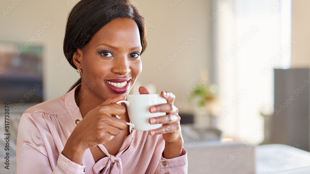 Successful businesswoman drinking a cup of coffee at home Successful businesswoman drinking a cup of coffee at home