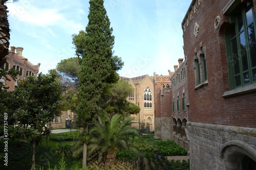 Fototapeta Naklejka Na Ścianę i Meble -  Hospital Sant Pau. Barcelona Spain. 06. September. 2014. The hospital complex was built in 1901-1930. in the El Ginardo area. The ensemble of buildings of the Hospital of the Holy Cross and St. Paul