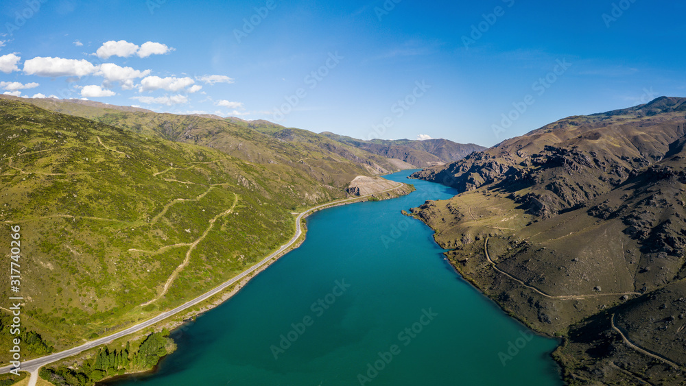 Blue river inside a valley aerial view panorama