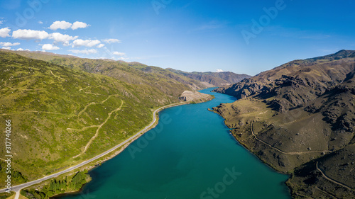 Blue river inside a valley aerial view panorama