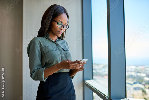 Sending texts while overlooking the city from an office tower Free Download Sending texts while overlooking the city from an office tower - GFXLoad