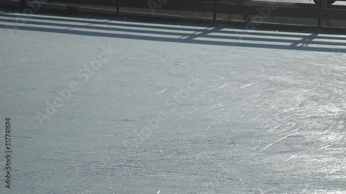 Wallpaper Mural Person skating on ice rink at winter day. Only ice texture and legs with skates visible. Leisure activities and winter sports concept. Slow motion footage. Torontodigital.ca
