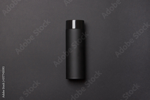 black thermos cup on black background