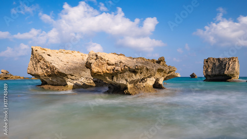 longexposure, Fazayah Beach, Salalah Oman, Fantastic seascape, great outdoor scene of Beauty of nature concept background, blue sea, few clouds, rocks in the water