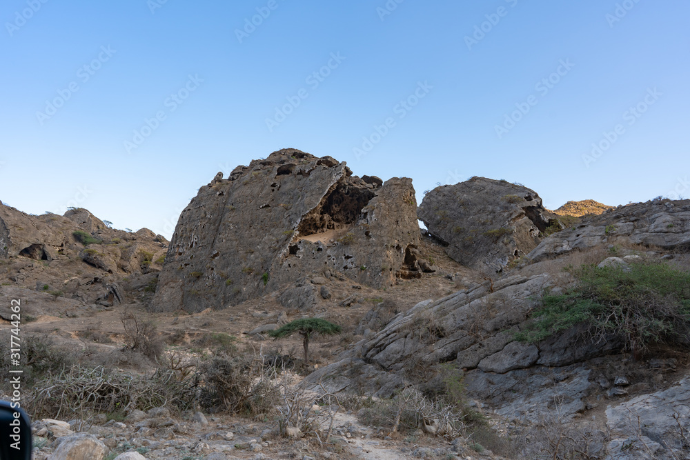 mystic landscape, rocks in a desert, beautiful blue sky