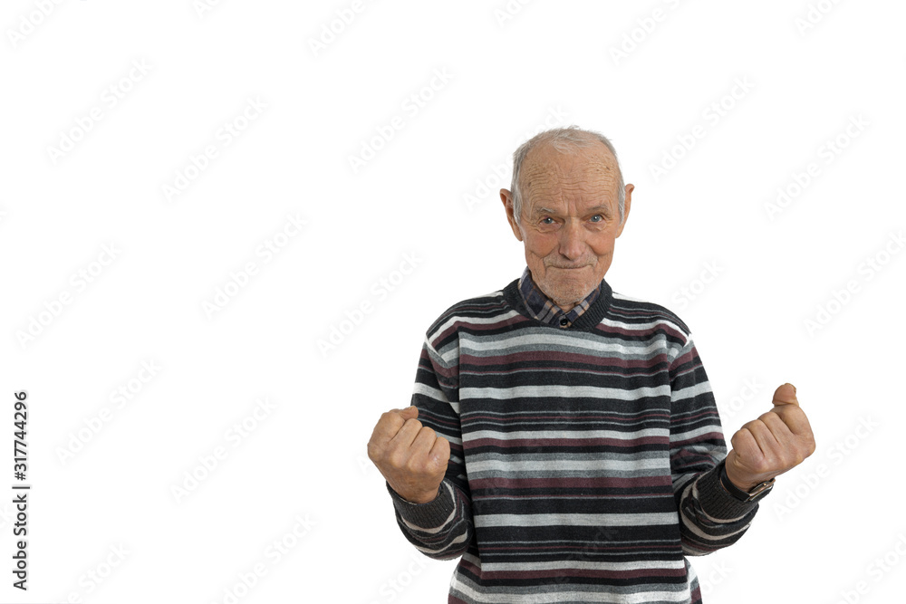 Waist up portrait of the old man in casual clothes, senior is very happy and excited doing winner gesture with arms raise, looking at the camera, isolated over white background. Celebration concept Waist up portrait of the old man in casual clothes, senior is very happy and excited doing winner gesture with arms raise, looking at the camera, isolated over white background. Celebration concept