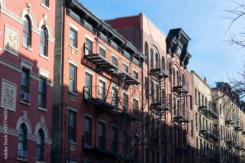 Colorful Old Buildings in Chelsea New York with Fire Escapes