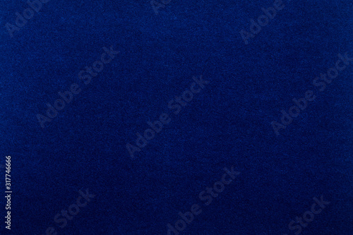 Blue background. Velvet paper texture.