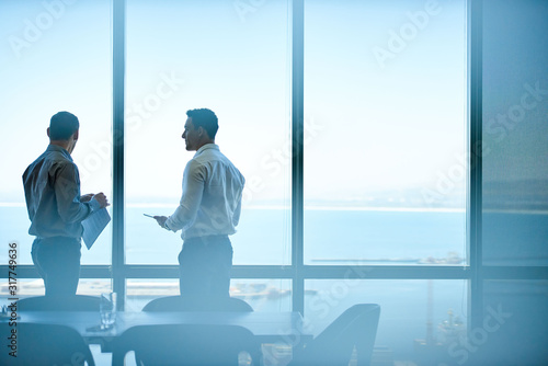 Executives discussing business from high up in an office tower