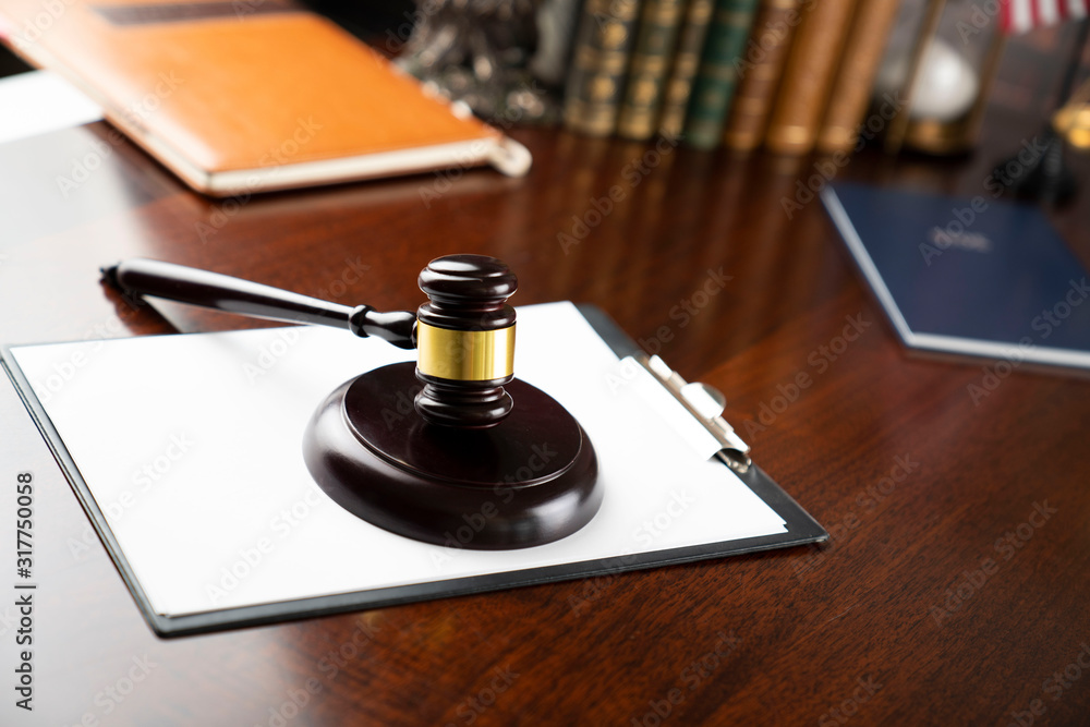 Law and justice theme, judge's gavel on court library background Law and justice theme, judge's gavel on court library background