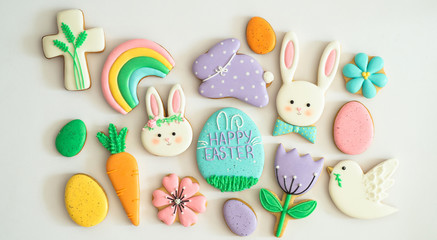 Happy Easter. Multicolored pastel easter cookies on a white background.