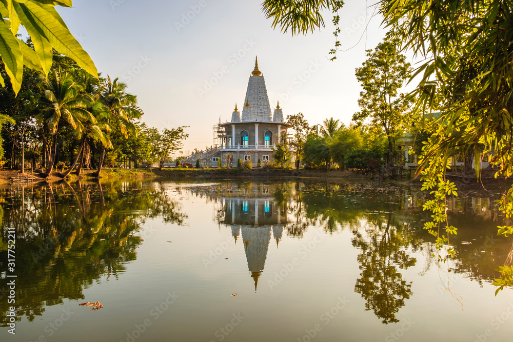 reflection of temple in water,beautiful white temple in thailand