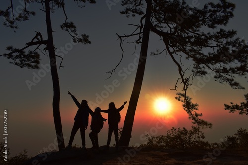 silhouette of man and woman at sunset