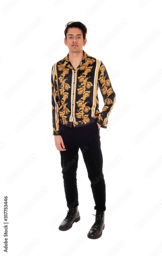 Tall man standing in a colorful shirt and black pants Tall man standing in a colorful shirt and black pants