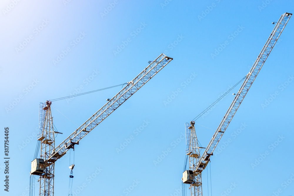Construction site, silhouettes of the construction industry. Construction, construction cranes