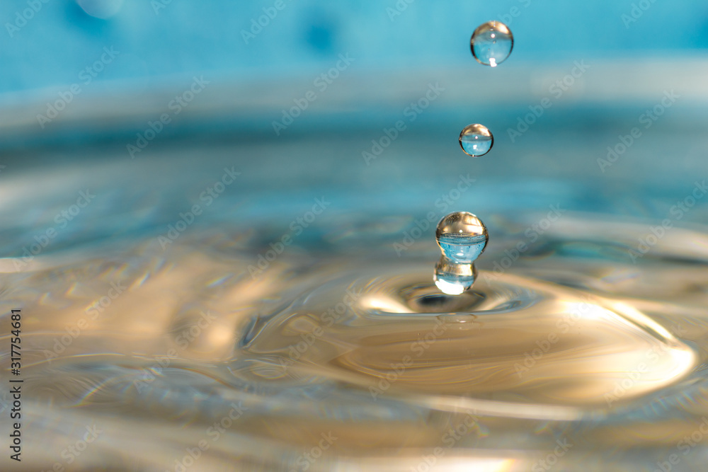 water droplets falling down and forming abstract shapes water droplets falling down and forming abstract shapes