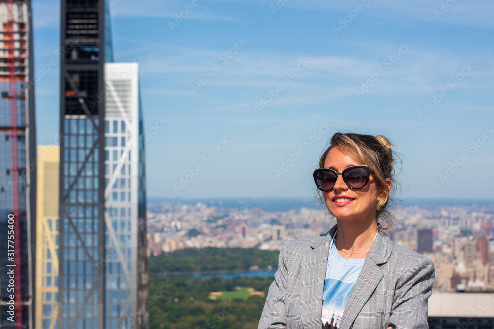 a woman against the backdrop of the city