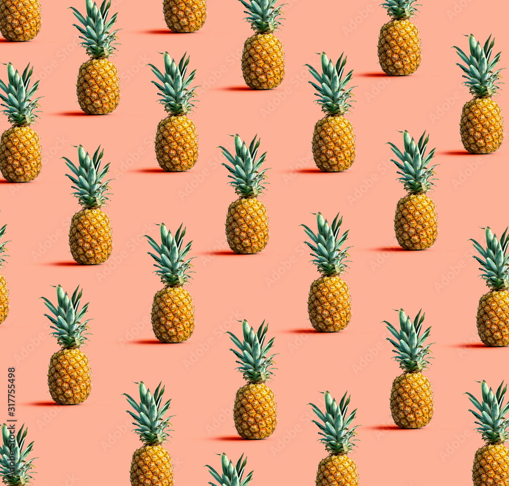 Many pineapples on a solid color background Many pineapples on a solid color background