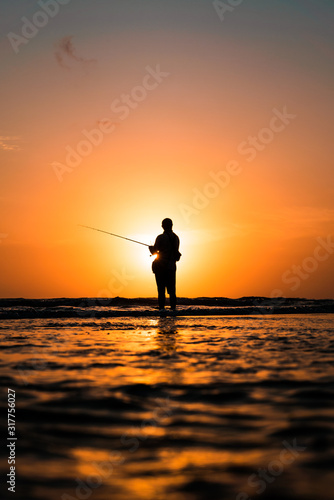 Sunset Fishing in Bali Silhouette