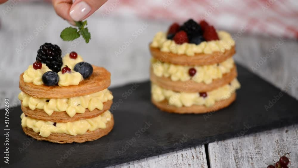 French dessert millefeuille of puff pastry and custard cream. French dessert millefeuille of puff pastry and custard cream.