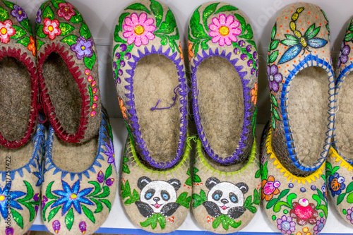 Russian national shoes. Sale of Russian Souvenirs in the boutique. Russian warm Slippers. Selling shoes in the store.