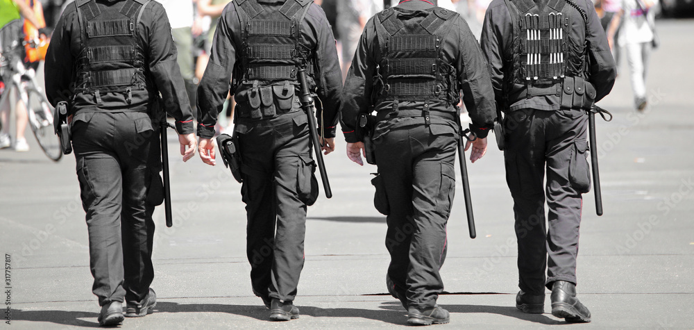 policemen in riot gear during a demonstration policemen in riot gear during a demonstration