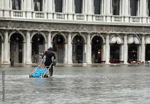 Porter on the water in Saint Mark in Venice Italy photo