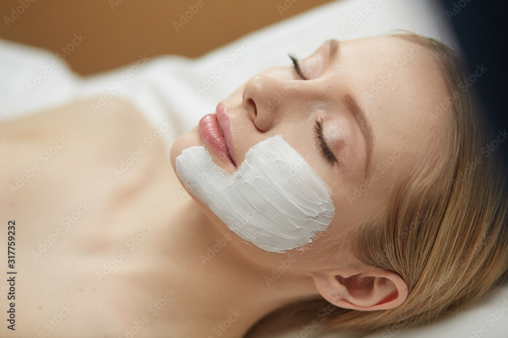 Beautiful young woman in cosmetic salon close up Beautiful young woman in cosmetic salon close up