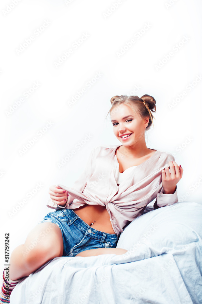 young pretty blond woman laying waiting for Christmas holiday in warm socks in bed isolated on white background, lifestyle people concept young pretty blond woman laying waiting for Christmas holiday in warm socks in bed isolated on white background, lifestyle people concept
