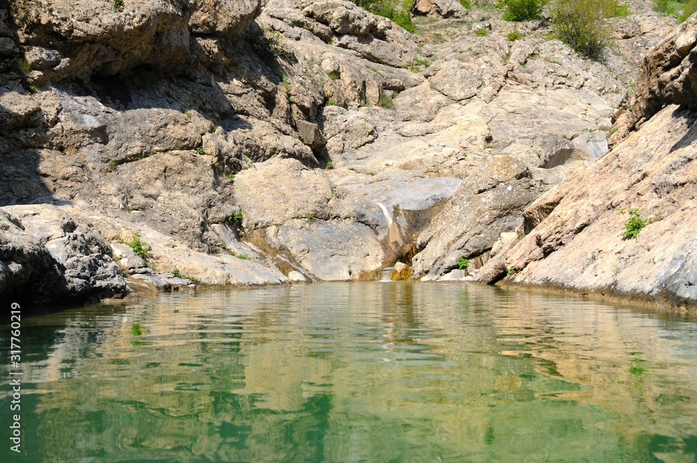 Mountain lake with bright green water Mountain lake with bright green water