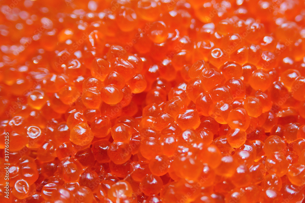 Red caviar background. Salmon and trout caviar, close up. Seafood menu. Healthy Food. Expensive delicatessen salted. Red caviar background. Salmon and trout caviar, close up. Seafood menu. Healthy Food. Expensive delicatessen salted.