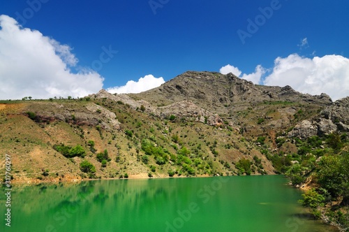 Lake with azure water located among mountains