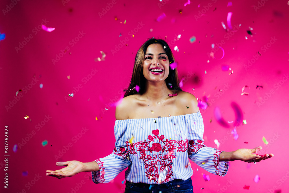Joyous woman with confetti celebration