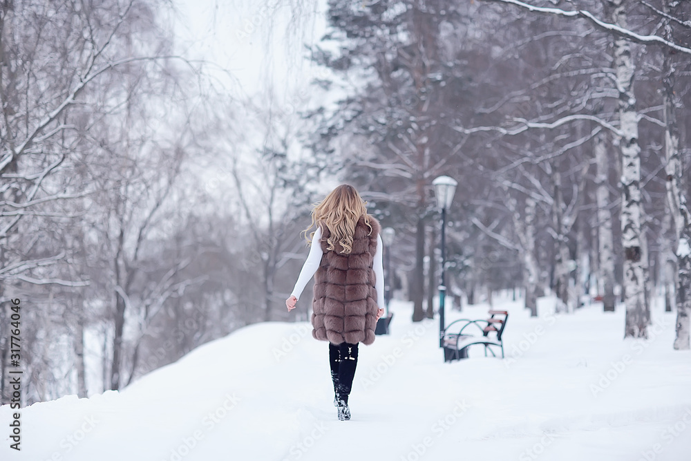 winter blonde / young adult model, blonde with long beautiful hair posing in the winter season