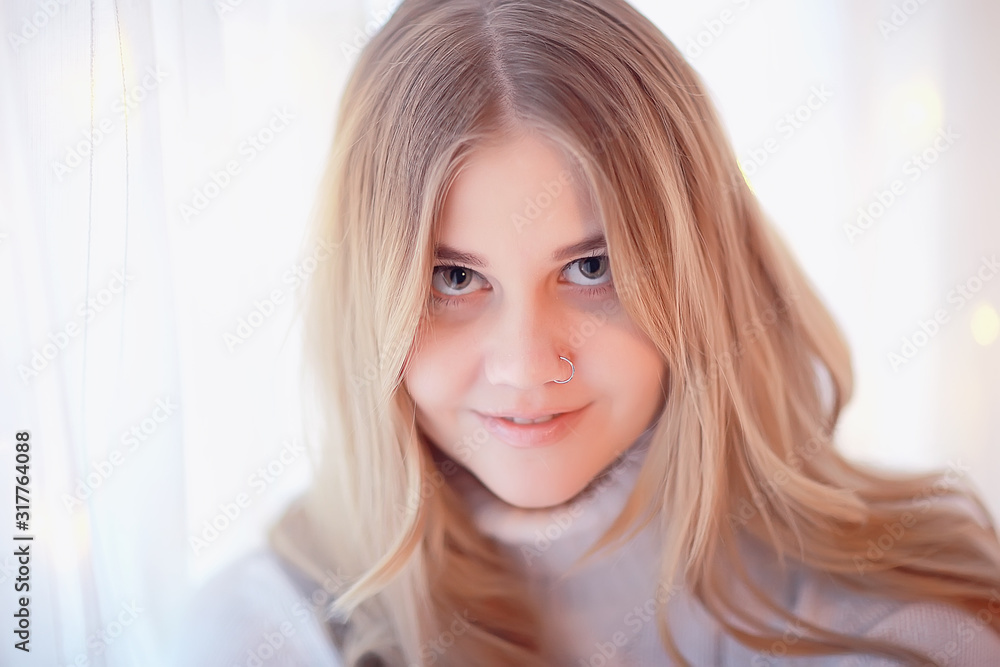 cute blonde sweater portrait / winter look, portrait of beautiful model with long hair in cold season