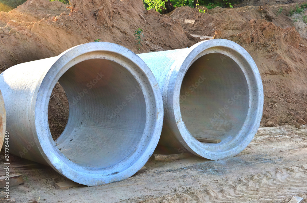 Laying or replacement of underground storm sewer pipes. Installation of water main, sanitary sewer, and storm drain systems. Utility Infrastructure. Soft focus Laying or replacement of underground storm sewer pipes. Installation of water main, sanitary sewer, and storm drain systems. Utility Infrastructure. Soft focus