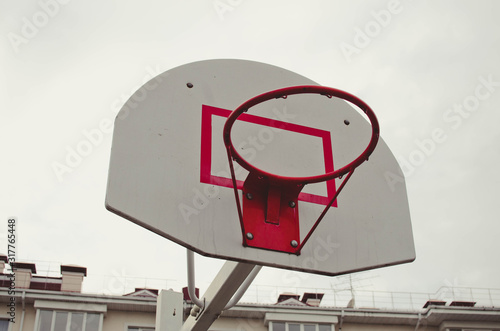 basketball ring in cloud covered sky. close-up